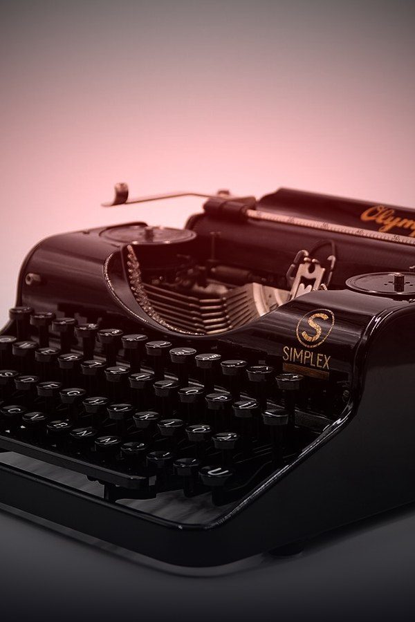 Vintage typewriter in low light — True Story true-crime collection on KemoTV